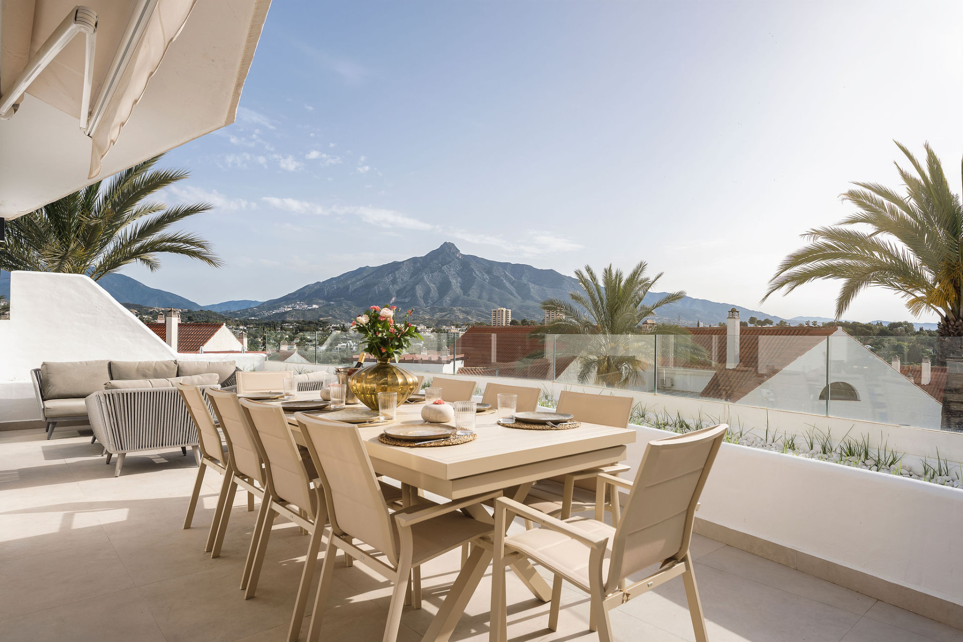 Outdoor dining terrace at Jardines de Andalucía with views of La Concha, Marbella