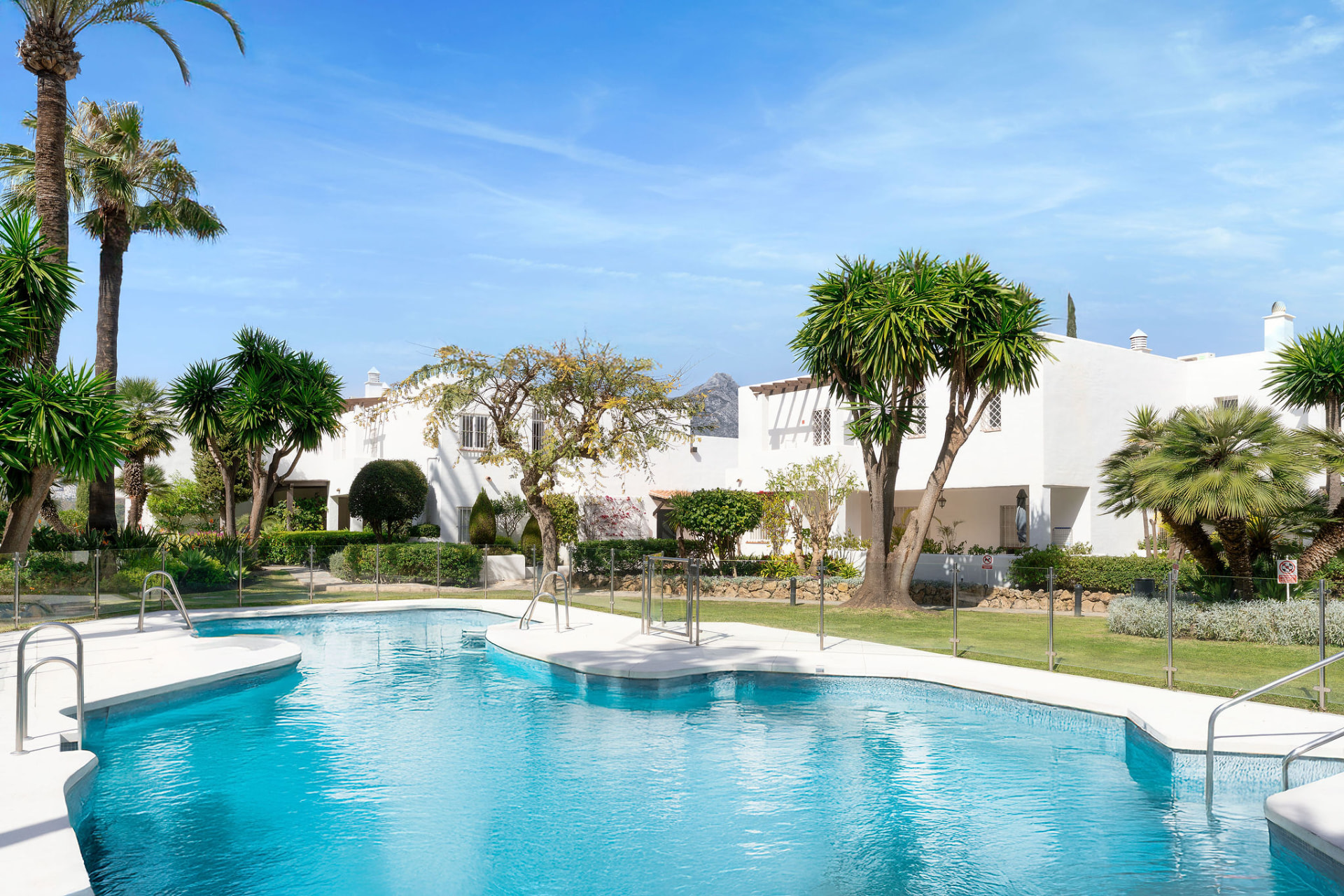 Communal pool and tropical gardens at Jardines de Andalucía, Marbella